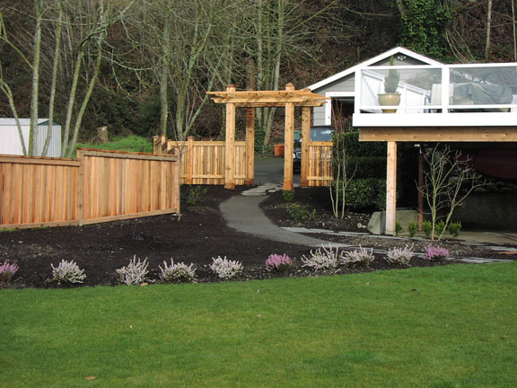 Pergola and wooden privacy fence