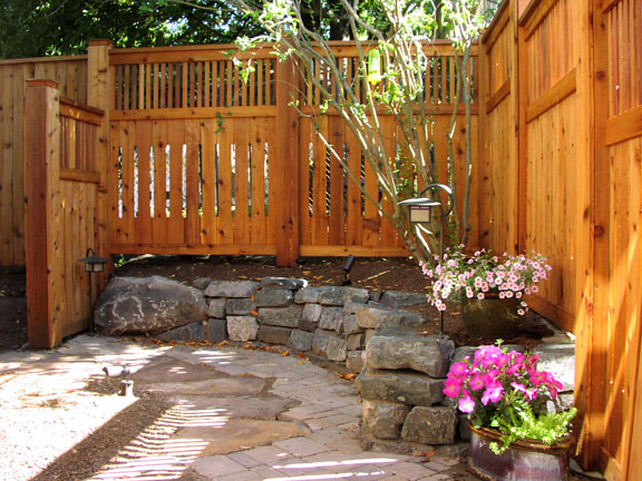 Fences with stained finishes designed by Environmental Construction Inc. in Kirkland WA