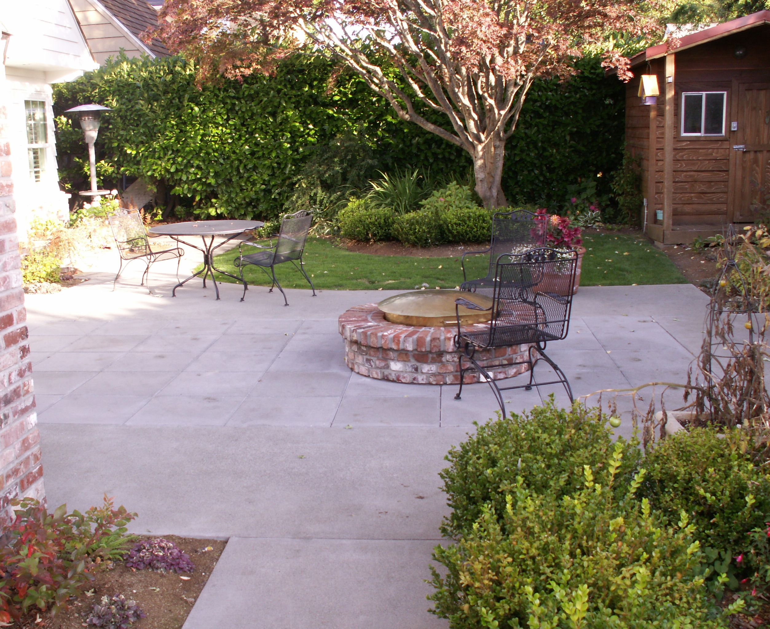 Brick fire ring and patio designed by Environmental Construction Inc. in Kirkland WA