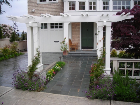 Front-entry landscape and tile driveway designed by Environmental Construction Inc. in Kirkland WA