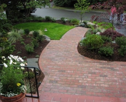 Red brick walkway designed by Environmental Construction
